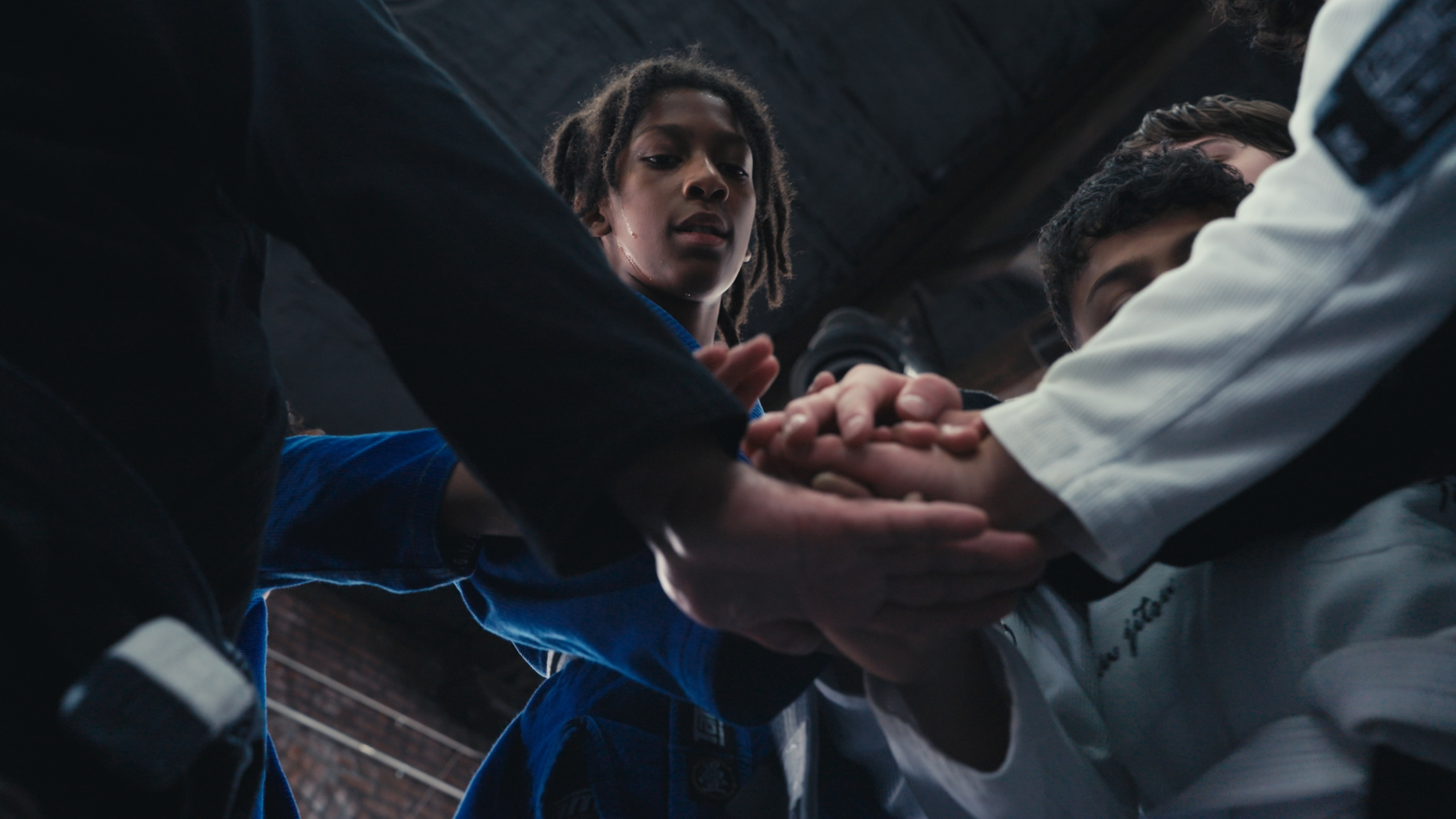 Brazilian jiu-jitsu students sharing a team moment