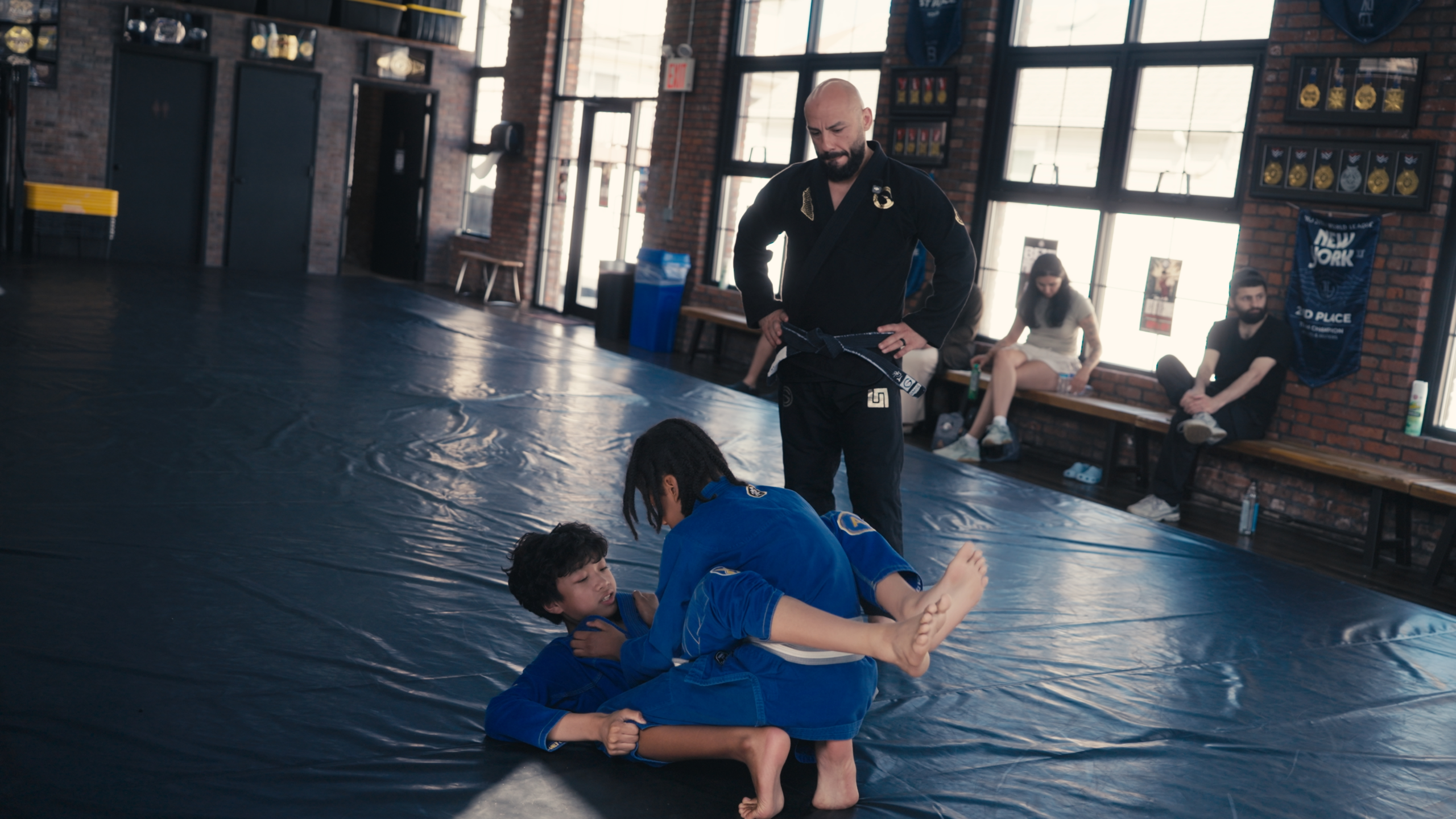 Professor teaching Brazilian jiu-jitsu students