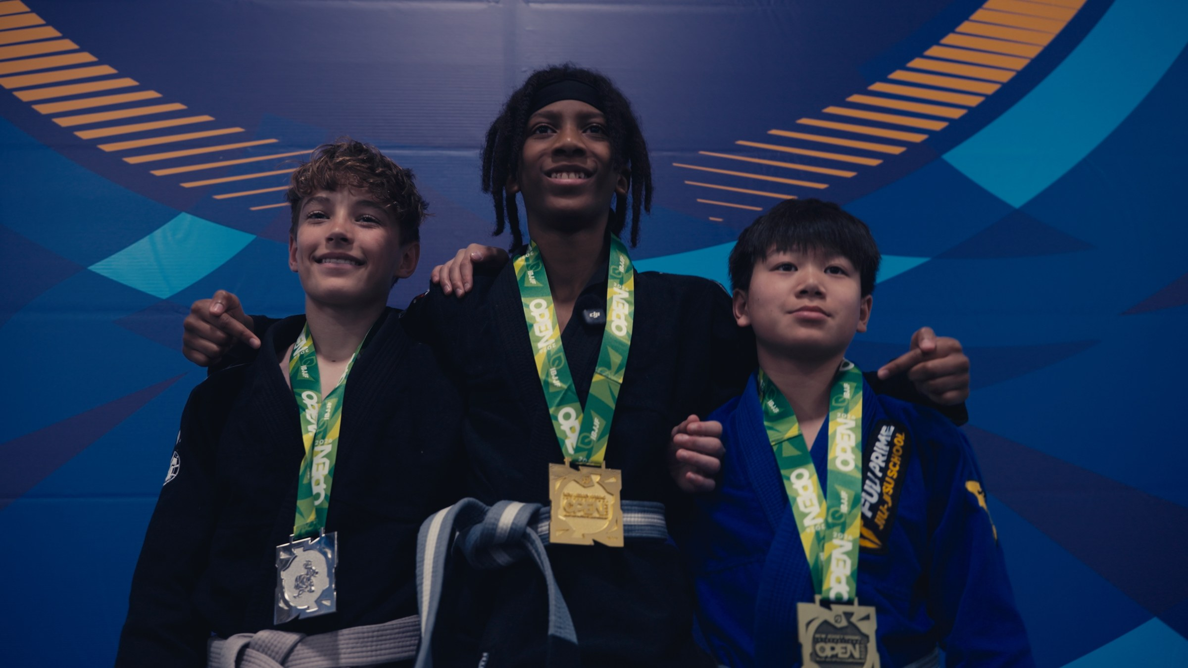 Jiu-jitsu competitor celebrating on the podium